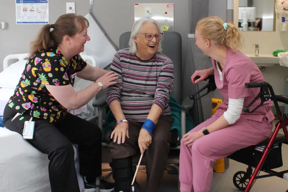 Allied Health Assistant Donna Martin and Occupational Therapist Abbie Eastick help Armitage patient Jennifer Pettigrew