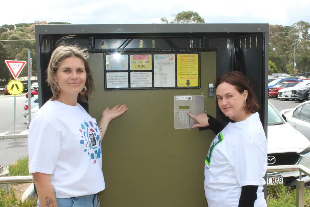Clinicians Jasmin Friend and Sandra Smith with the dispensing machine at Wonthaggi Hospital