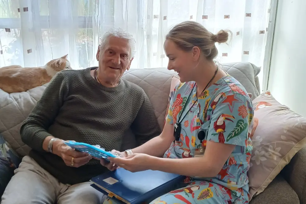 Bass Coast Health District Nurse Georgie Young checks on client John Christensen in his home