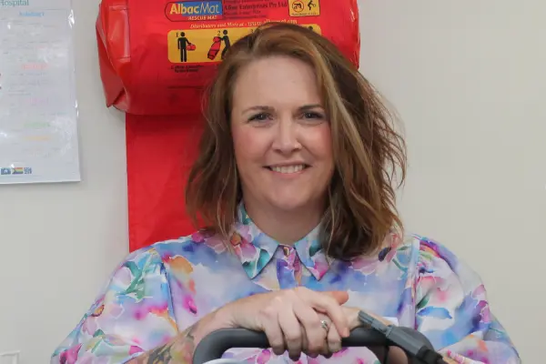 Kelly Amber of Ambling Along Tours and Transfers with the defibrillator at Wonthaggi Hospital’s maternity unit bought with the proceeds of a golf day at Phillip Island Golf Club.